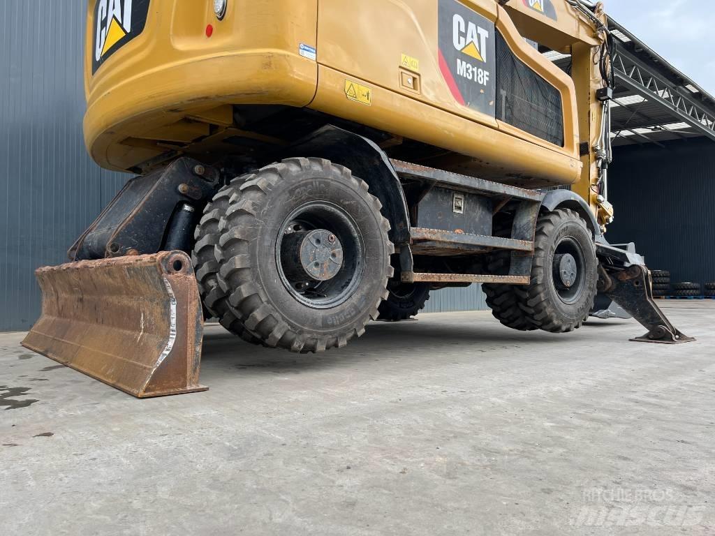 CAT M318F Bagri na kolesih
