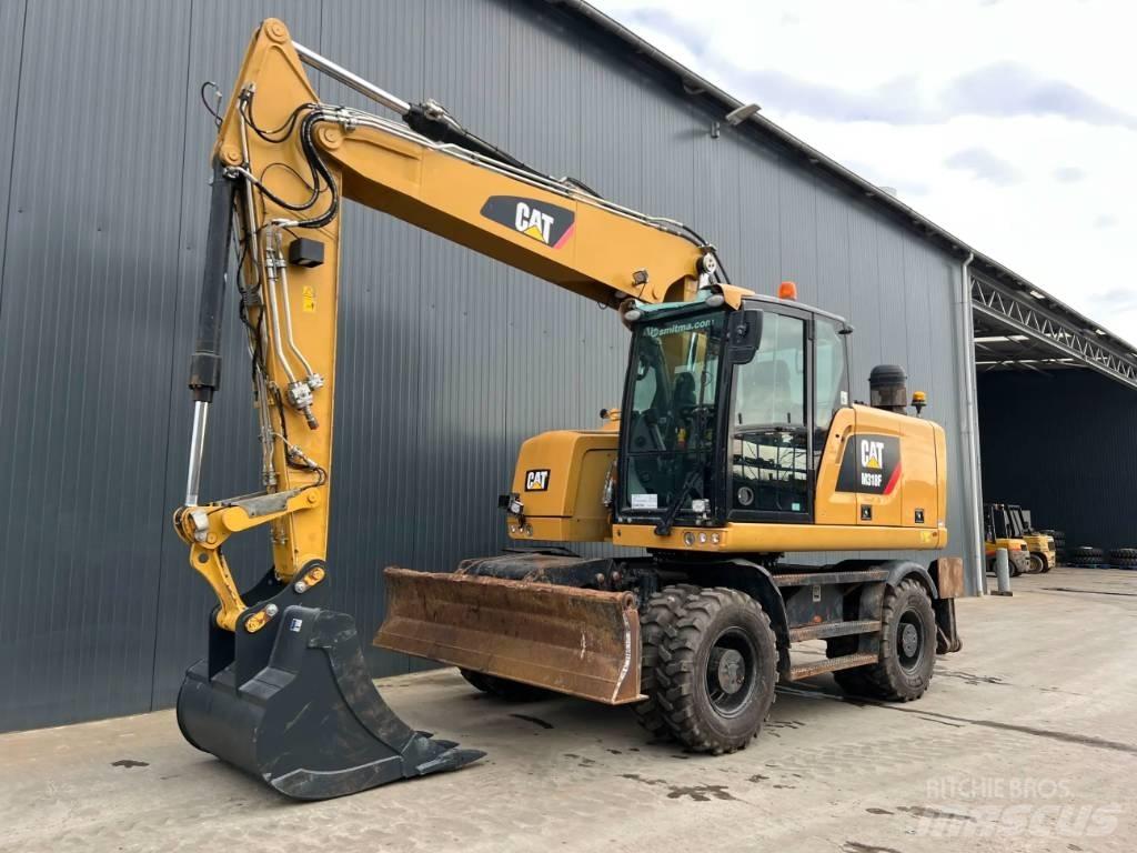CAT M318F Bagri na kolesih