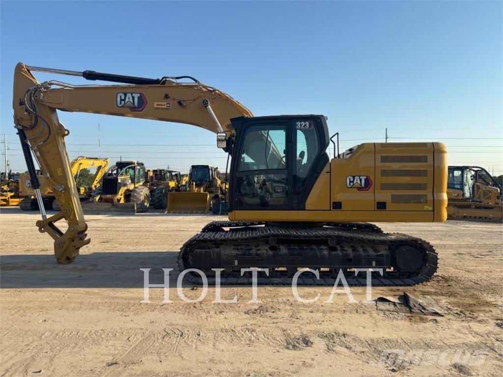 CAT 323 TC Kolesni nakladalci
