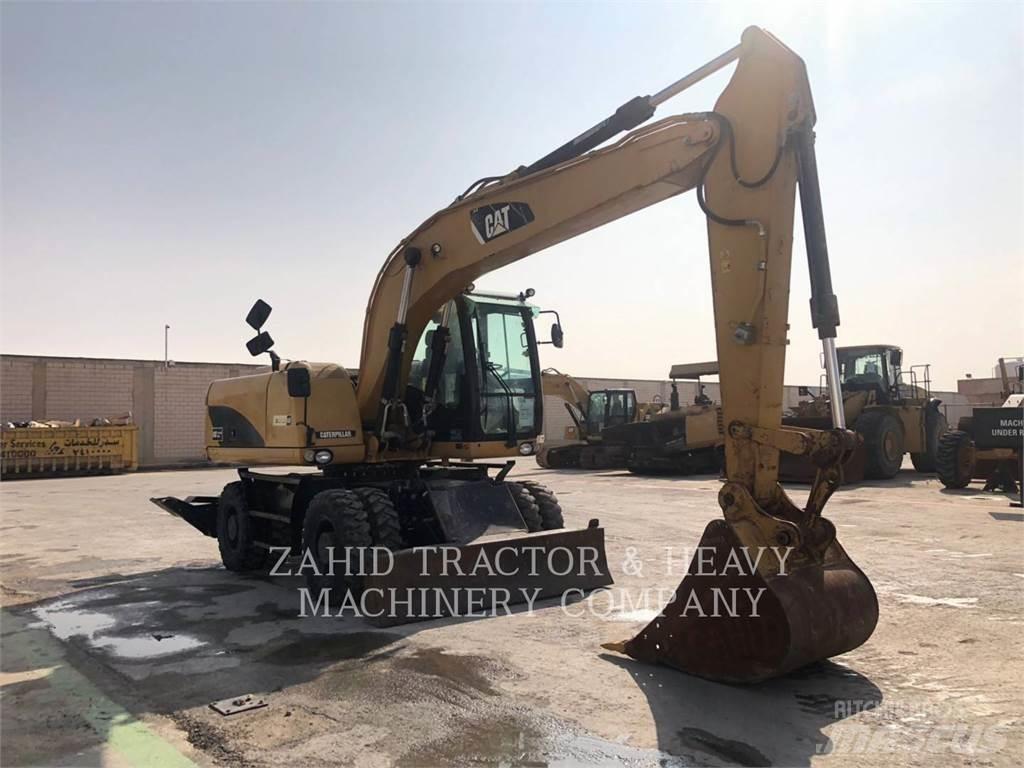 CAT M317D Bagri na kolesih