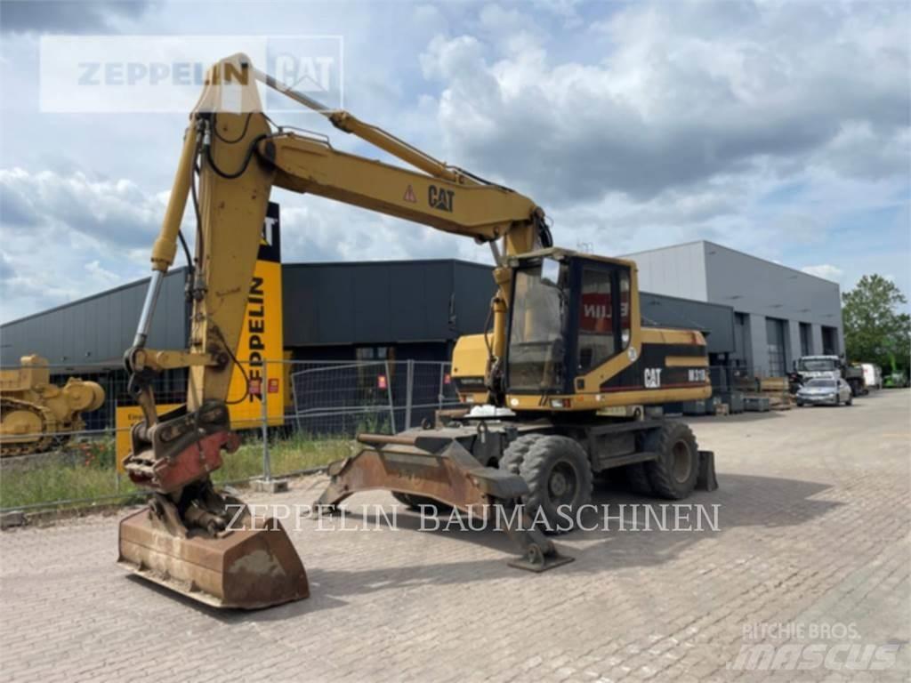 CAT M318 Bagri na kolesih