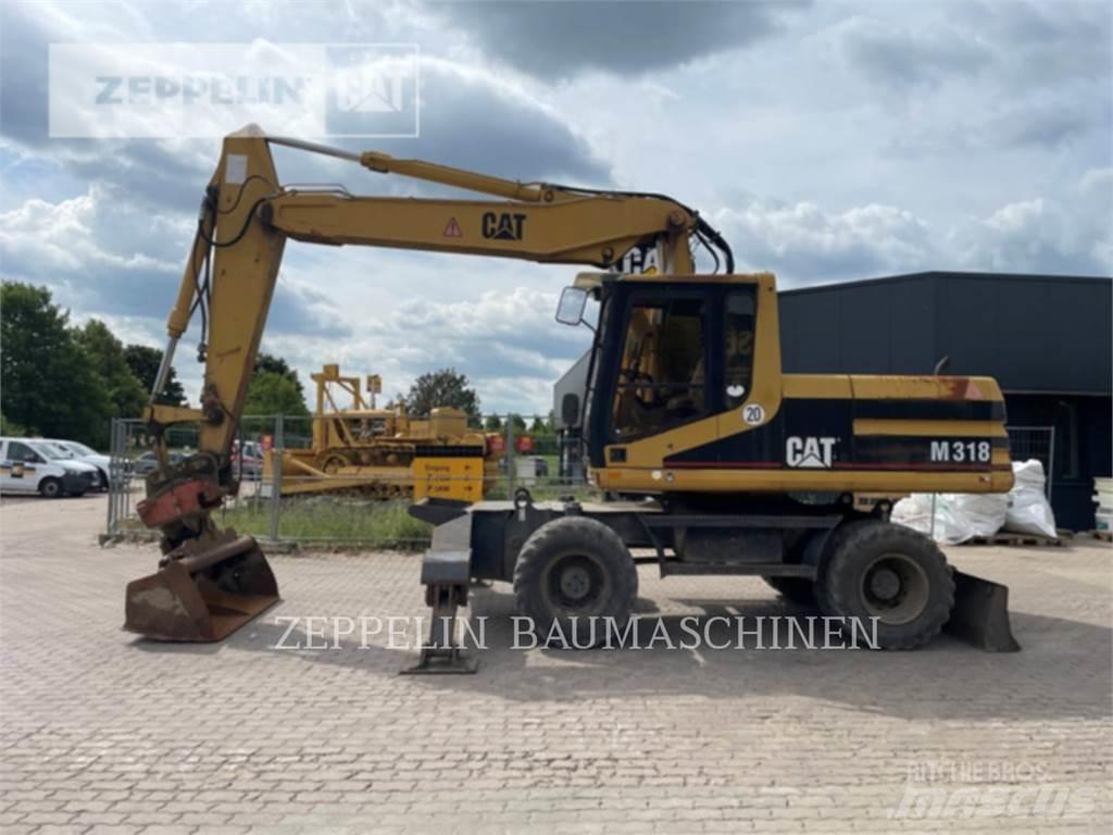 CAT M318 Bagri na kolesih
