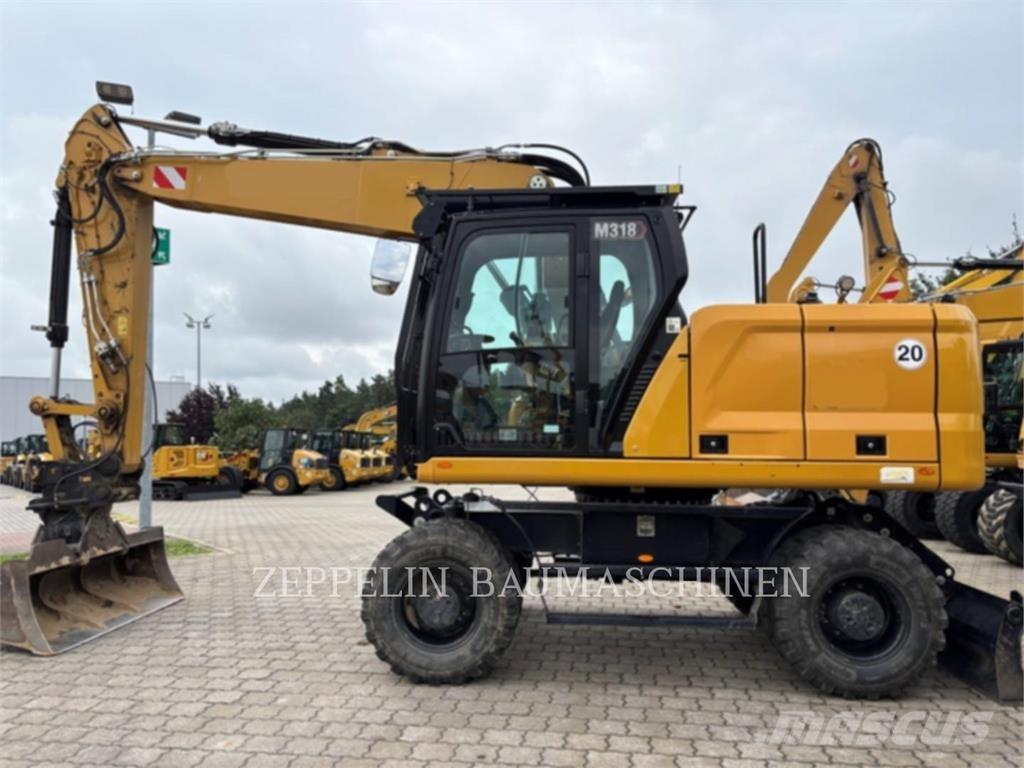 CAT M318-07A Bagri na kolesih