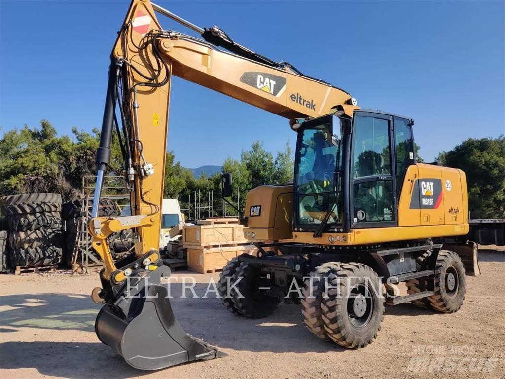 CAT M318F Bagri na kolesih