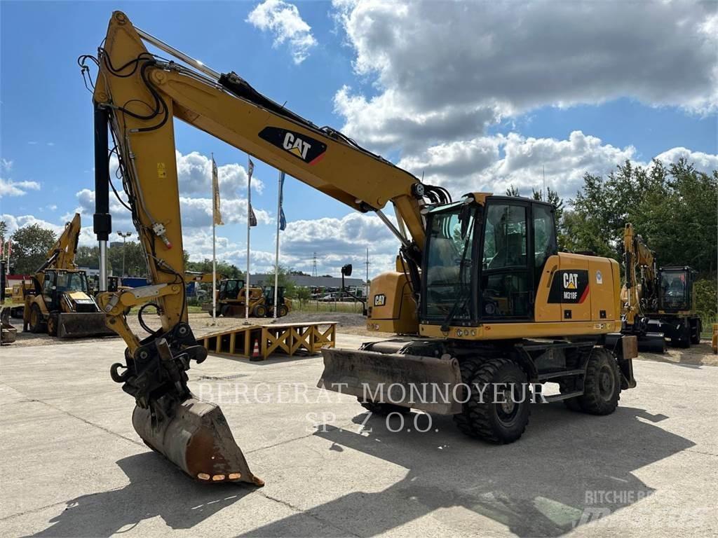 CAT M318F Bagri na kolesih