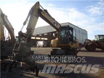 CAT M318F Bagri na kolesih
