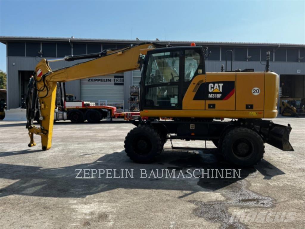 CAT M318F Bagri na kolesih