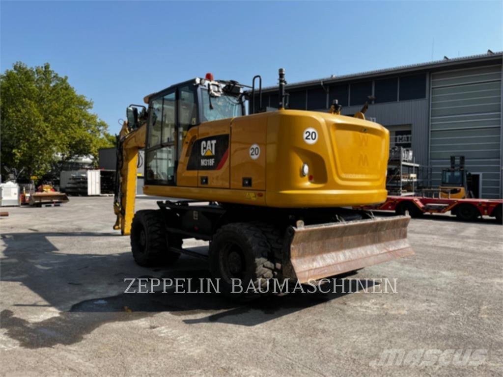 CAT M318F Bagri na kolesih