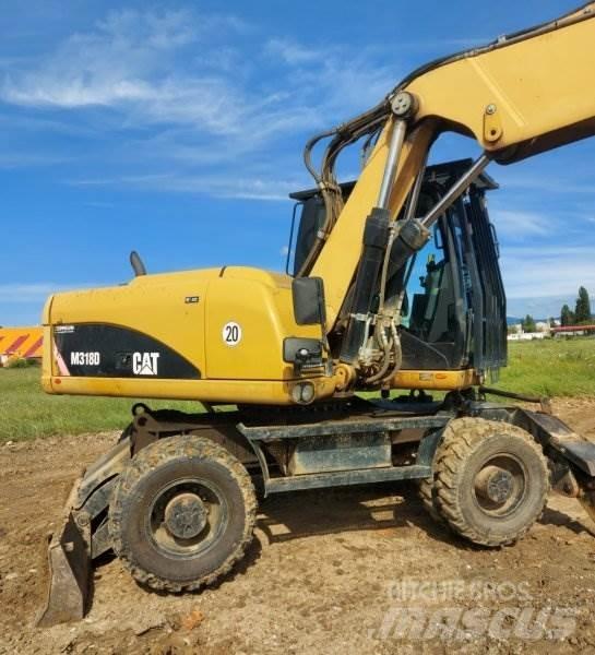 CAT M318 D Bagri na kolesih