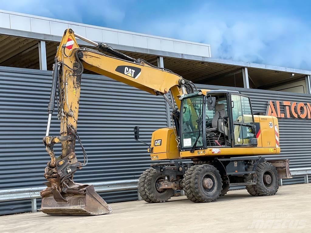 CAT M318F Bagri na kolesih