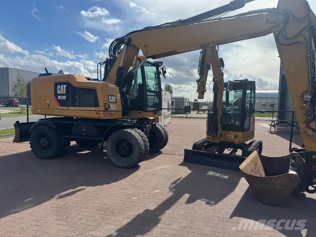 CAT 318 Bagri na kolesih