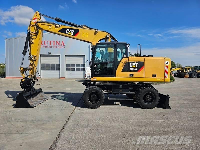 CAT M320F Bagri na kolesih