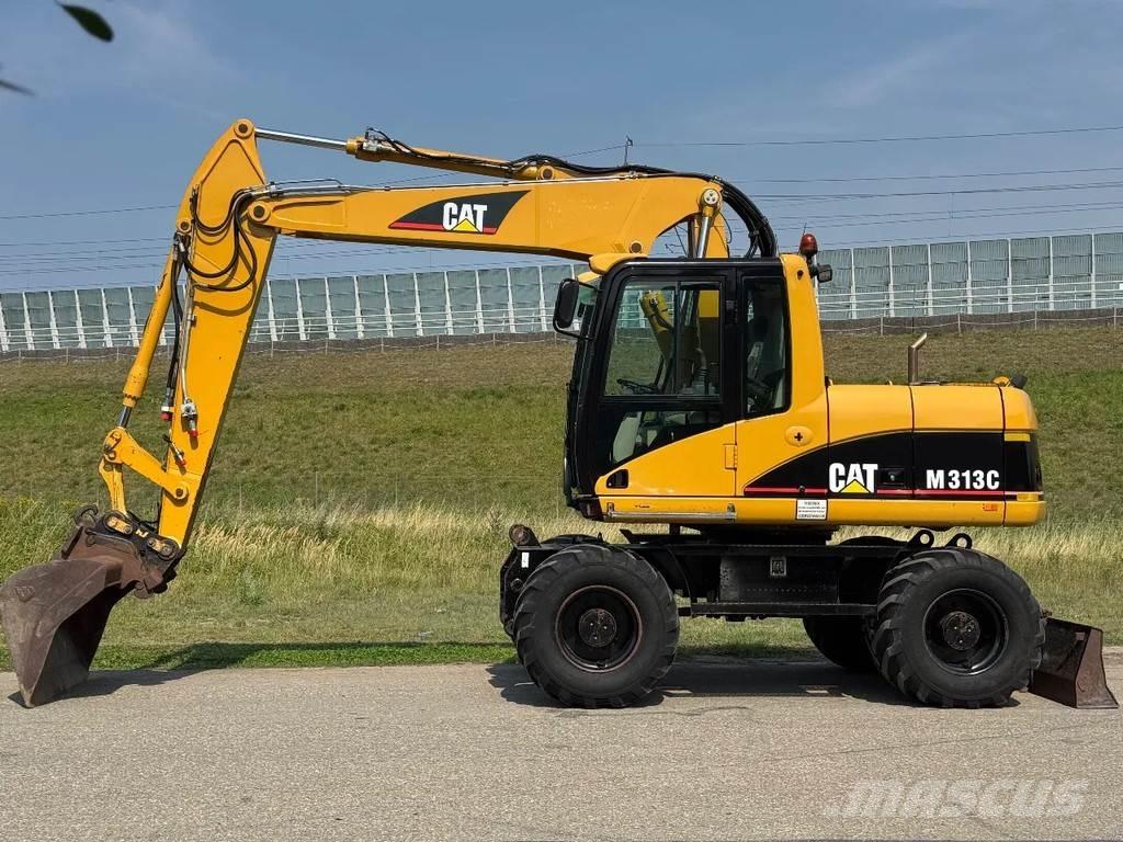 CAT M313C Bagri na kolesih