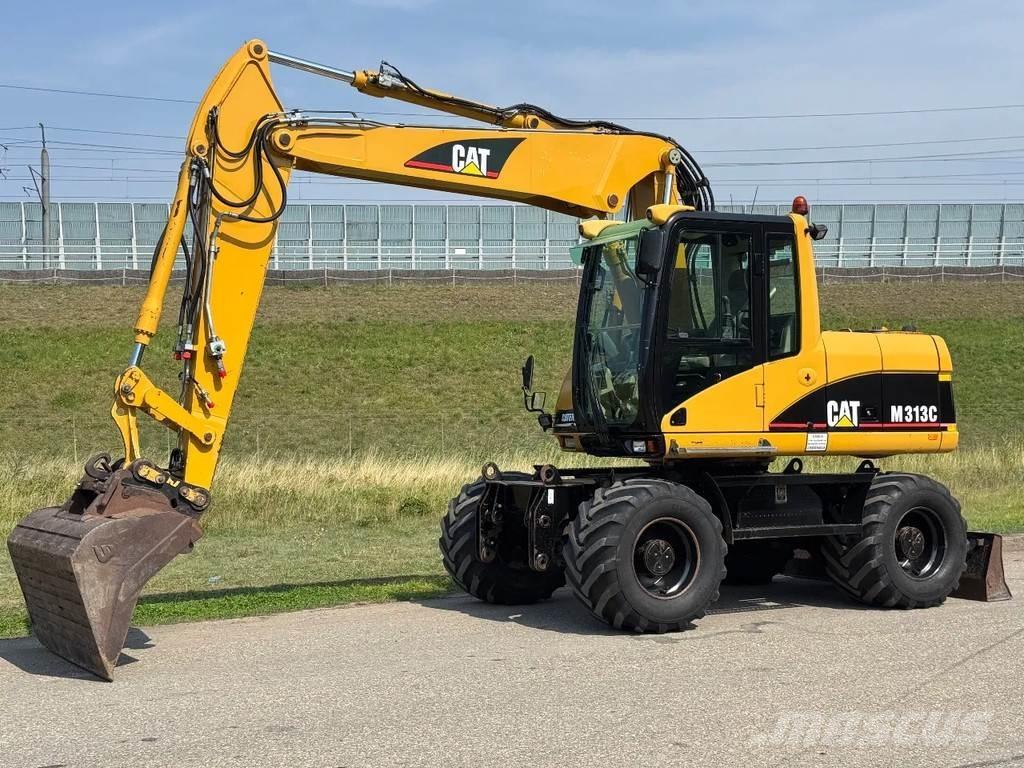CAT M313C Bagri na kolesih