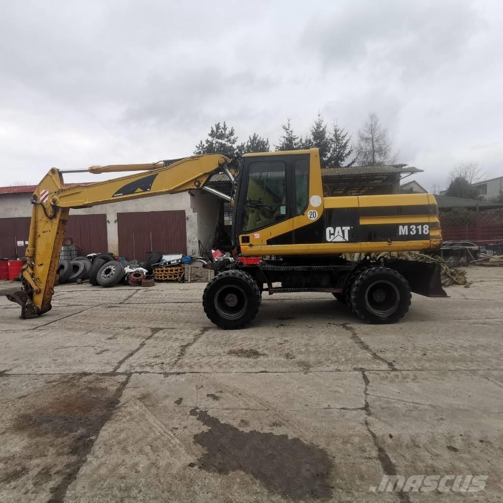 CAT M 318 B Bagri na kolesih
