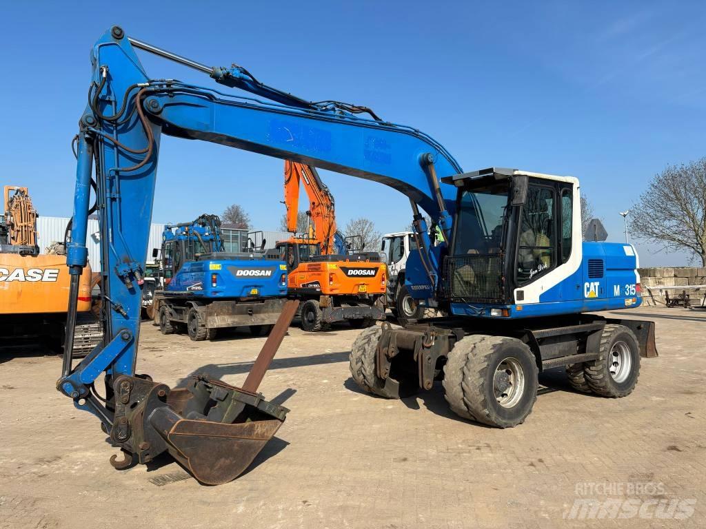 CAT M 315 Bagri na kolesih