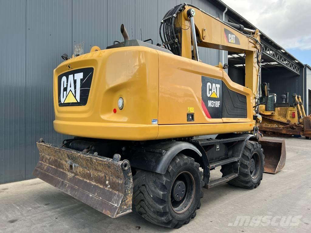CAT M318F Bagri na kolesih