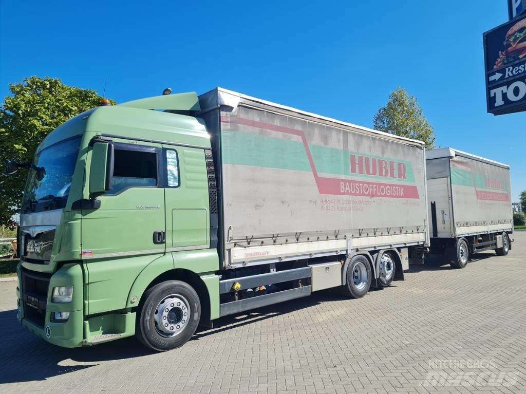 MAN 26.440  7.4 + 7.3 Tovornjaki s ponjavo