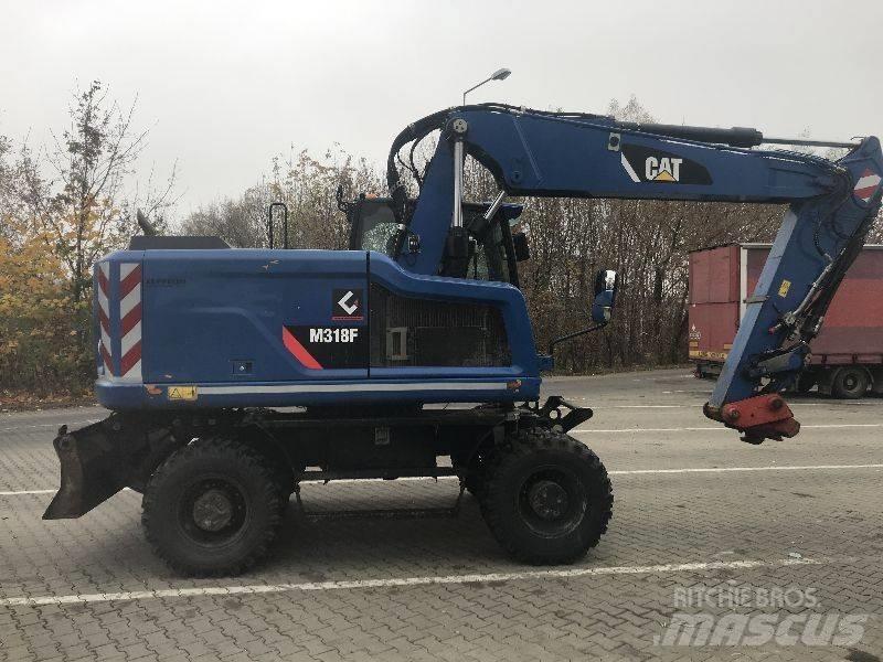 CAT M318F Bagri na kolesih