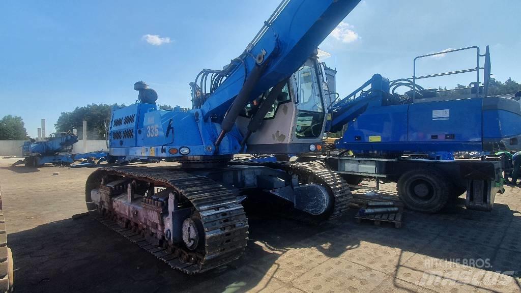 Fuchs RHL 335 Bagri za prekladanje primarnih/sekundarnih surovin