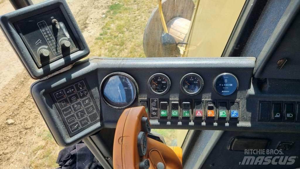 New Holland TC 56 Kombajni