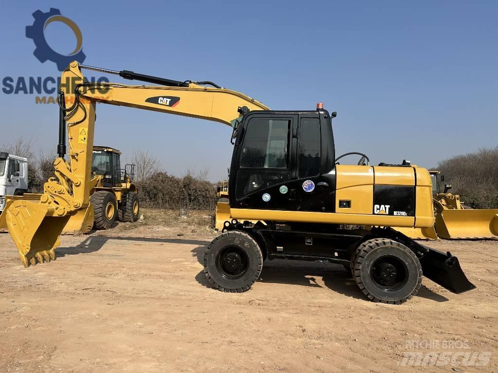 CAT M 320 D2 Bagri na kolesih