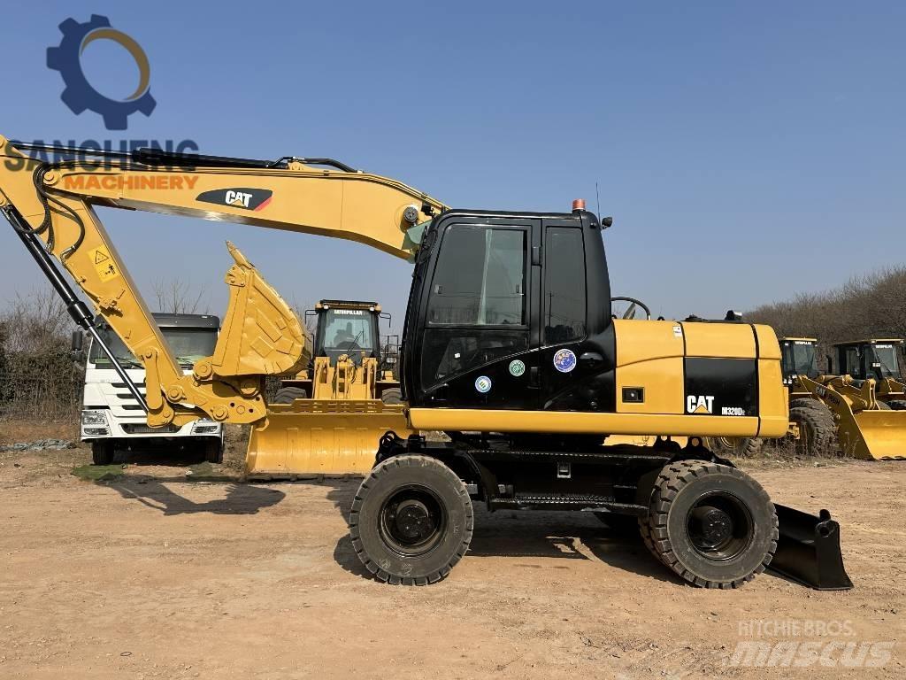 CAT M 320 D2 Bagri na kolesih