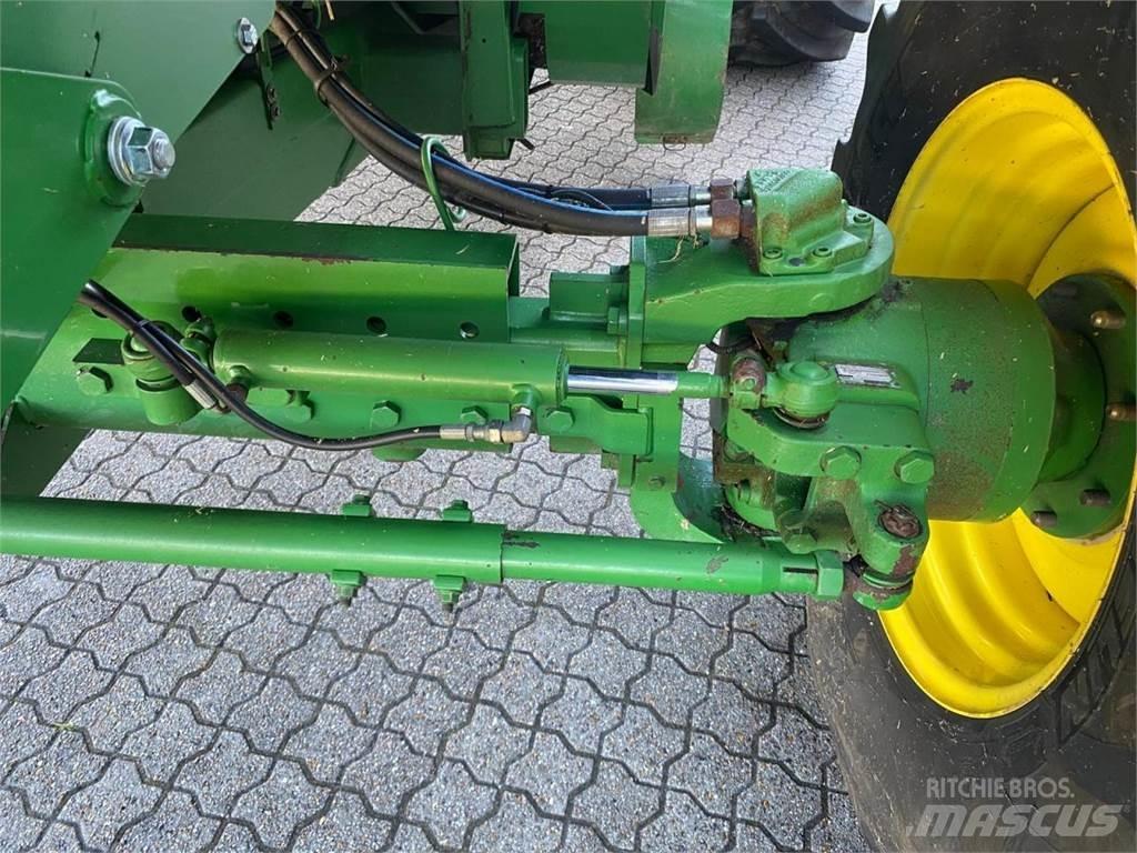 John Deere C670 Kombajni