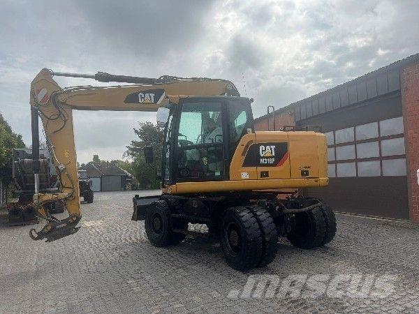 CAT M318F Bagri na kolesih
