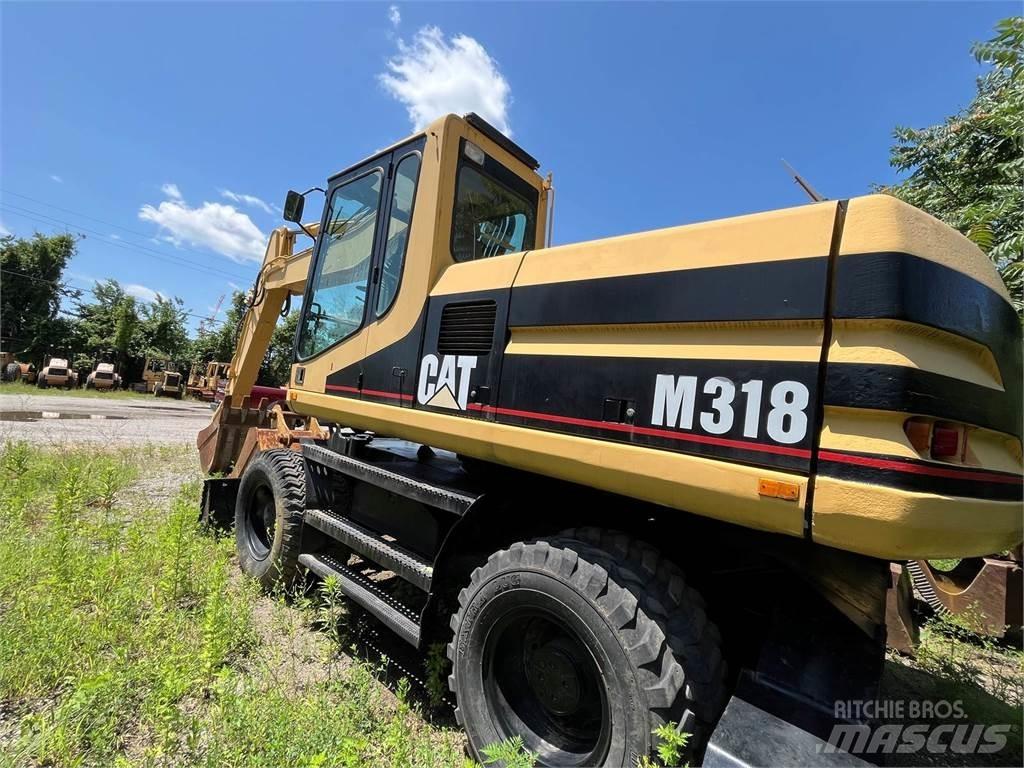 CAT M318 Bagri na kolesih