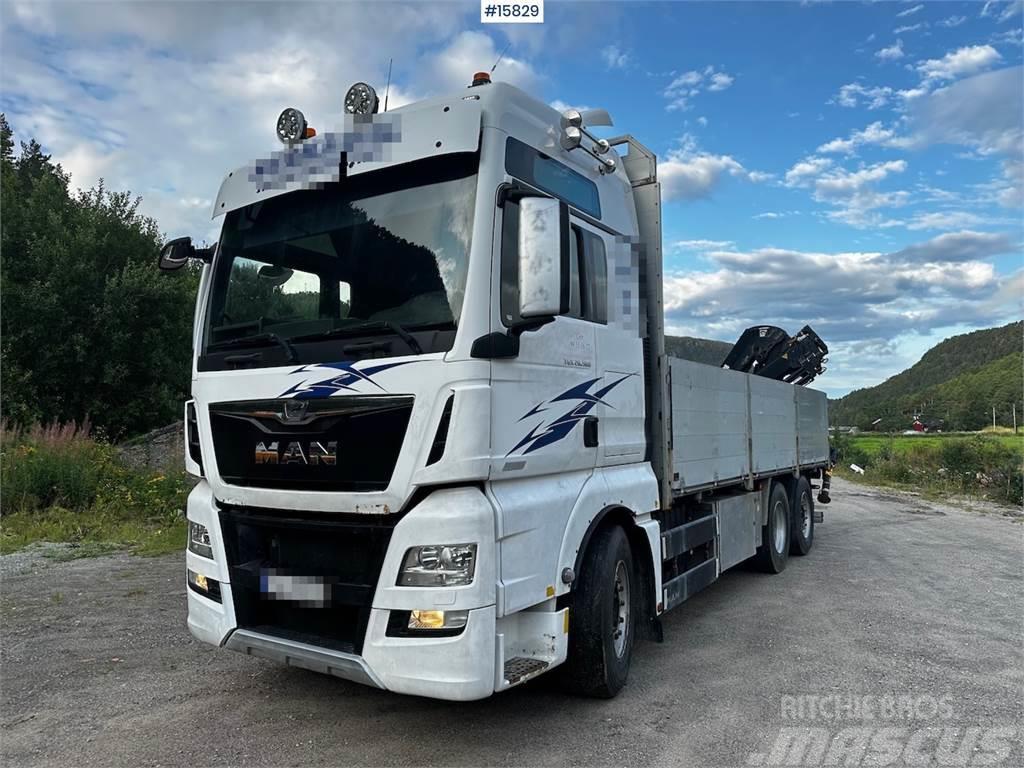 MAN TGX 26.560 Flatbed truck with Hiab 138 crane from  Tovornjaki s kesonom/platojem